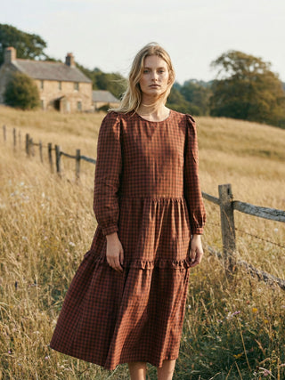 women in countryside wearing gingham dress
