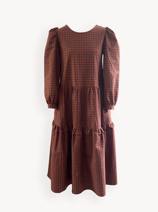 Brown checkered dress with puff sleeves on a white background