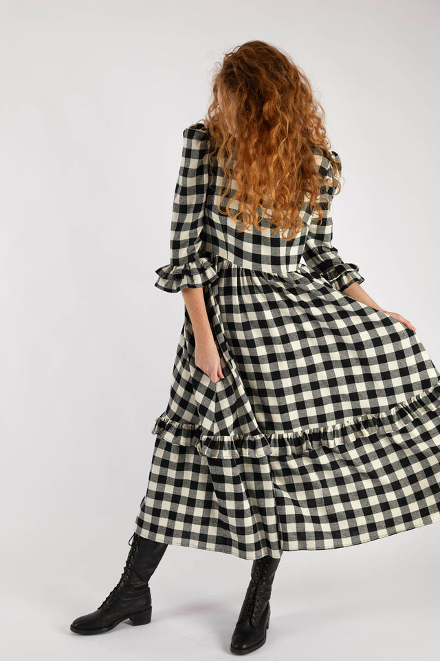 The Well Worn woman-wearing-oversized-gingham-dress