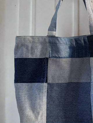 denim patchwork bag hung on wall 