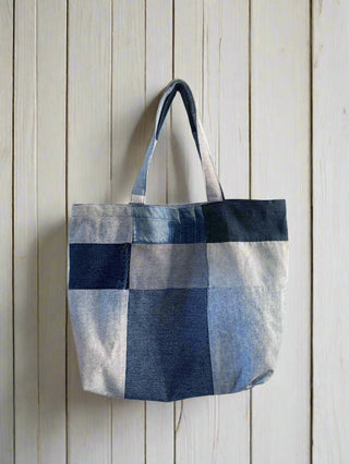 back denim bag hung on wall 