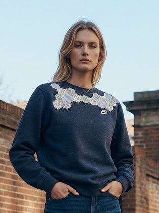 woman wearing patchwork sashiko sweatshirt