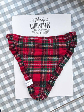 Red plaid neckerchief on a white card with 'Merry Christmas' text, on a checkered background.