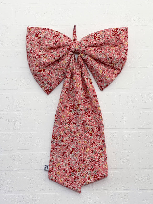 pink floral bow on wall