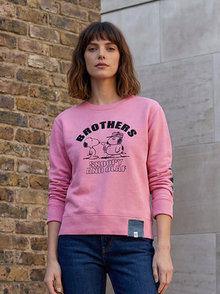 woman wearing pink snoopy sweatshirt