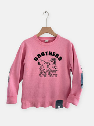 Pink sweatshirt with 'Brothers Snoopy and Olaf' design on a hanger against a white background