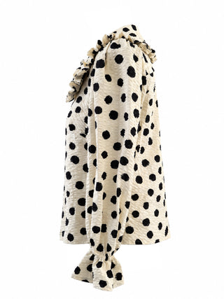 A big collar blouse polka dot pattern on a cream background, shown against a plain white studio background.