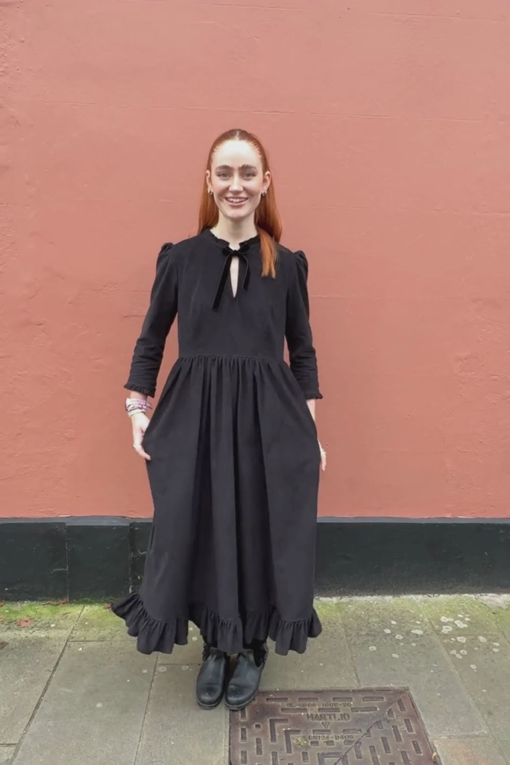 women in black dress video