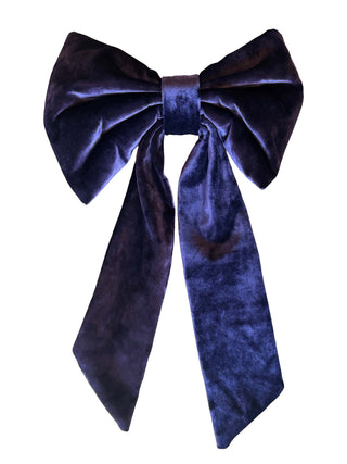 Purple blue velvet bow on a white background