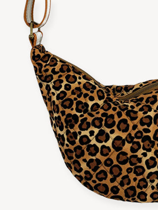 Leopard print handbag on a white background