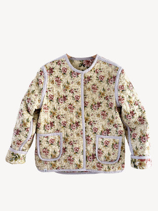 floral quilted jacket on white wall
