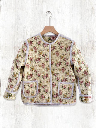 vintage quilted jacket on hanger
