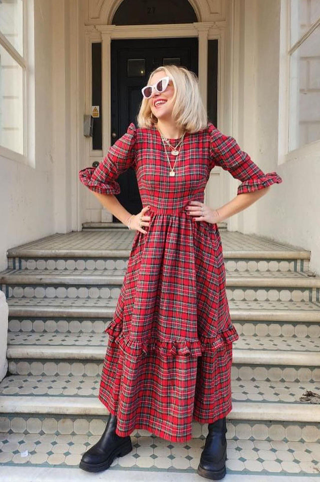 women wearing red tartan dress on steps