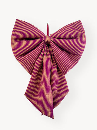 Red and bronze striped bow on a white background