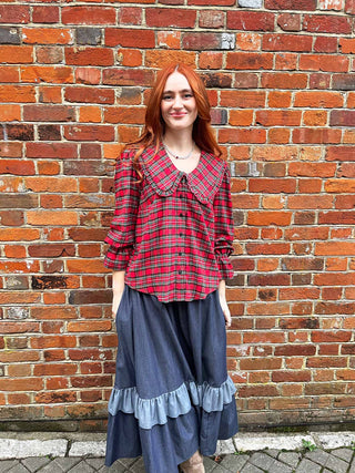 women wearing red tartan blouse