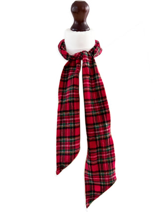 Red and black plaid scarf on a mannequin with a white background