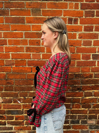 side women wearing tartan top
