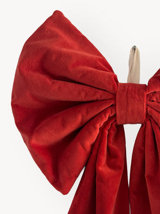 Red bow headband on a white background