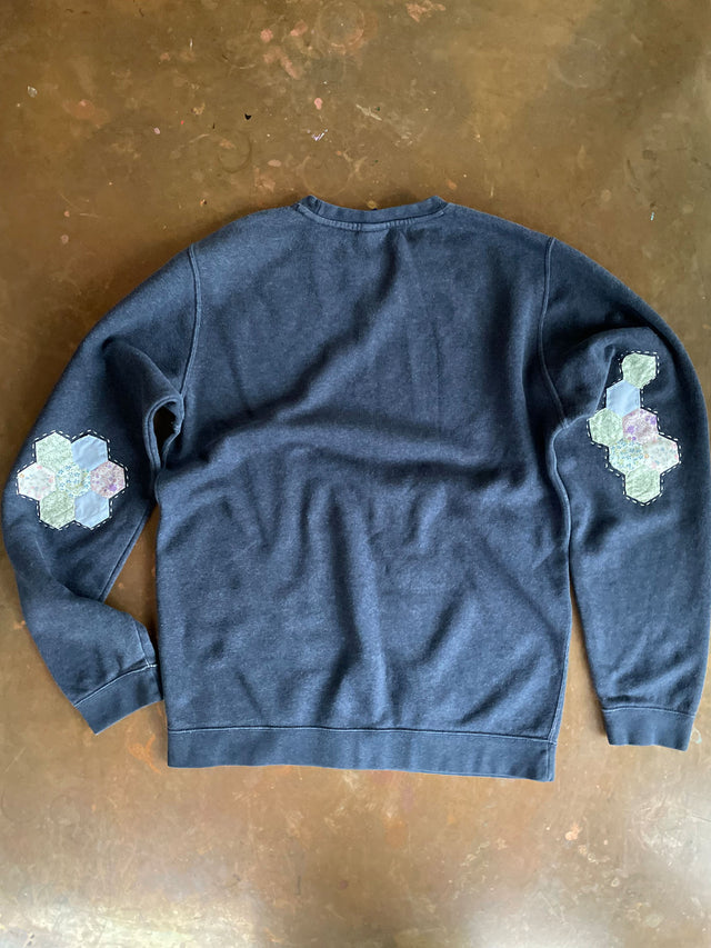 The Well Worn reworked sweatshirt on table back