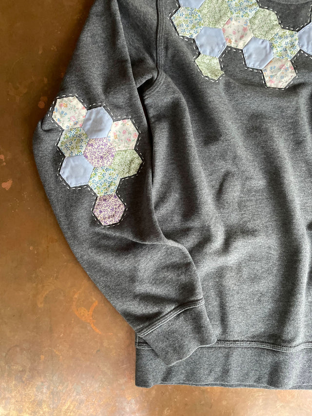 upcycled sweatshirt on table details