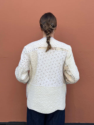 Neutral quilted jacket crafted from vintage quilt with ric rac accents, handmade by British brand The Well Worn