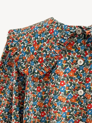 Multicolored floral pattern on a shirt with buttons.