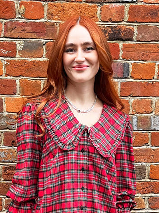 women wearing red tartan blouse collar