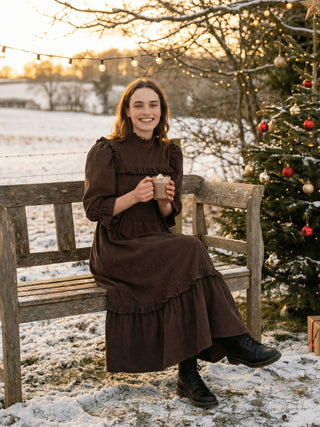 model wearing cord dress in winter scene