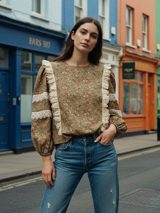 model wearing floral top in street