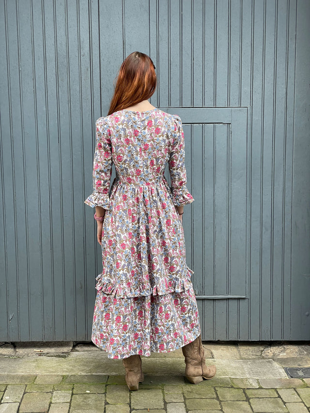 The Well Worn woman wearing floral dress back