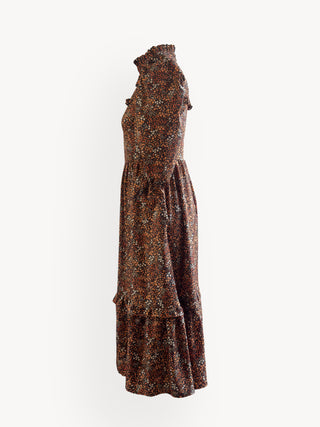 Brown floral patterned dress on a white background