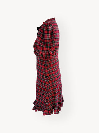 Red and black plaid skirt with ruffled hem on a white background