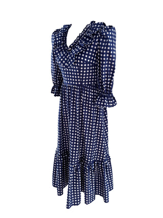 The Trixie Hand Block Print Dress in navy & white, showcasing ruffled details, a flattering V-neckline, and side pockets for added convenience.