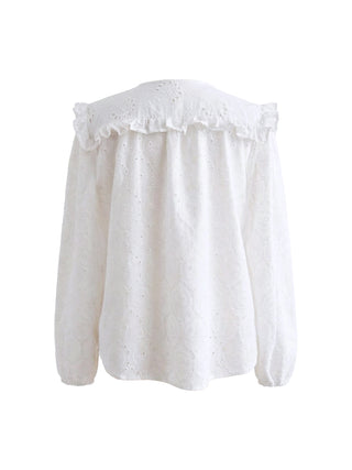 White blouse with ruffled neckline on a white background