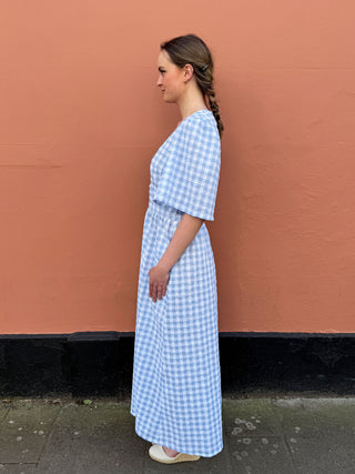British-made seersucker dress with gingham pattern, available in a limited run from The Well Worn

