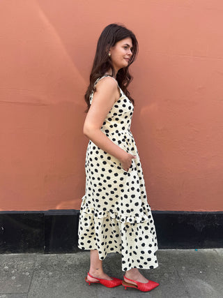 side view of women wearing spot dress