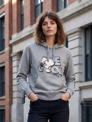 woman wearing upcycled snoopy sweatshirt