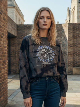 woman wearing snoopy sweatshirt in town