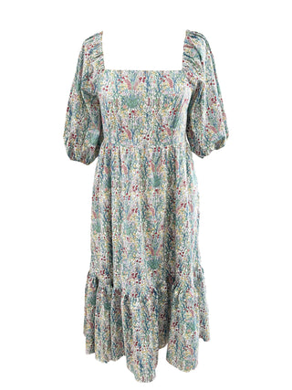 A bohemian-style midi dress with a square neckline, puff sleeves, and a tiered ruffle hem, featuring an all-over multicolor floral and paisley print on a light sage green base.