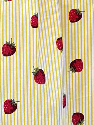 Pattern of red strawberries on a yellow and white striped background