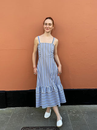 model wearing stripe dress with pockets