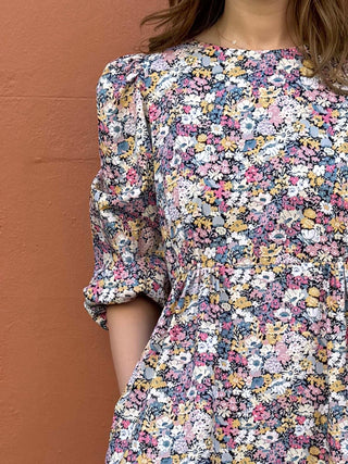 Close-up of handpicked floral print on The Maisie Dress made with breathable deadstock cotton.