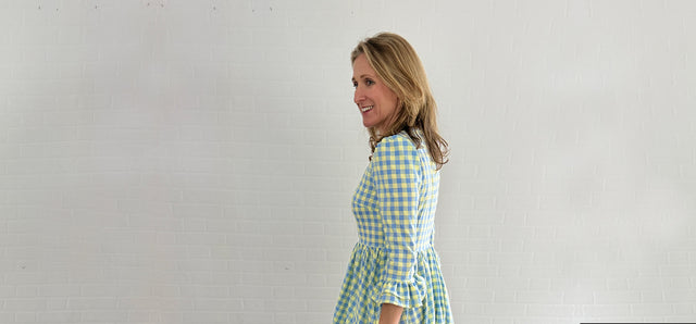 The Well Worn woman wearing sustainable gingham dress
