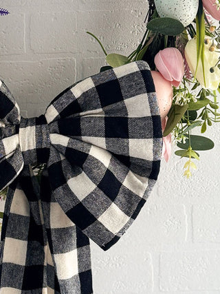 Handmade eco-friendly fabric bow on a seasonal Easter wreath, crafted from sustainable and deadstock fabric