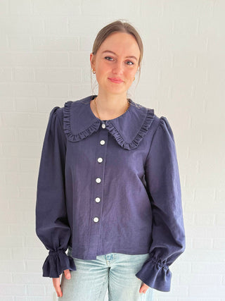 Model wearing Luna French Navy Blouse made from deadstock cotton-linen fabric