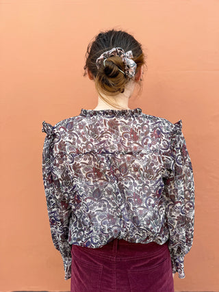 women wearing paisley boho blouse back view