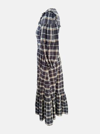 Plaid dress with ruffled shoulders on a white background