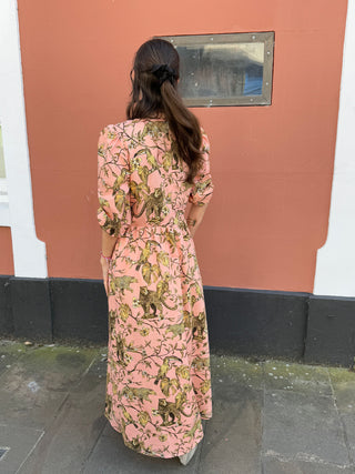 women wearing printed dress back view