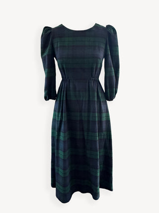 Green and black plaid dress with puffed sleeves on a white background