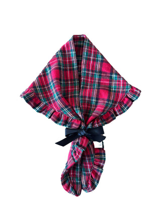 Plaid blanket with a black ribbon on a white background